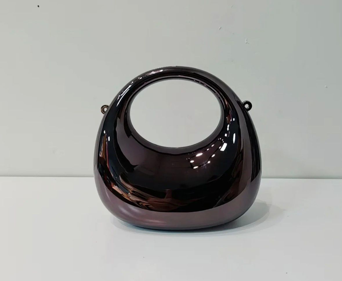 Black circular object on a white background