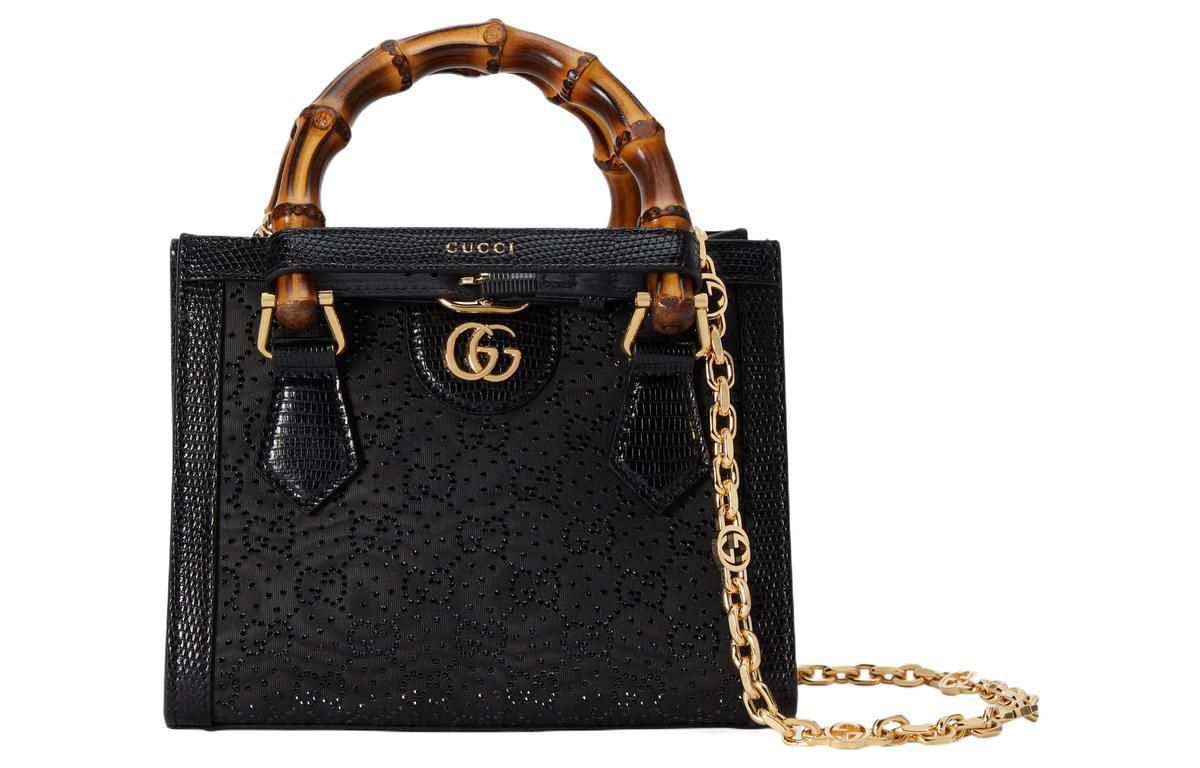 Black Gucci handbag with bamboo handle on a white background