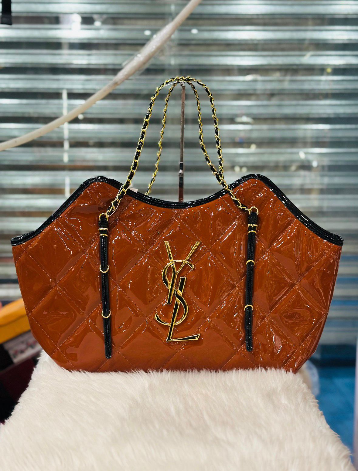 Saint Laurent (YSL) quilted patent leather handbag